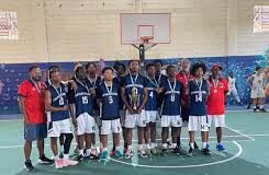 BASKETBALL-Cayman U-17 boys claim bronze in gritty International debut. Young Cayman players celebrating with bronze medals after final buzzer