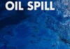 TRINIDAD-Trinidad says oil spill adequately dealt with, despite concerns from Venezuela. Cleanup crew working on oil-affected shoreline with containment booms