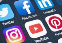 TRINIDAD-Police probing graphic video circulating on social media. Police officer reviewing social media content on laptop with evidence markers